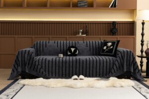 Luxurious living room with a dark patterned sofa cover, cozy setting.